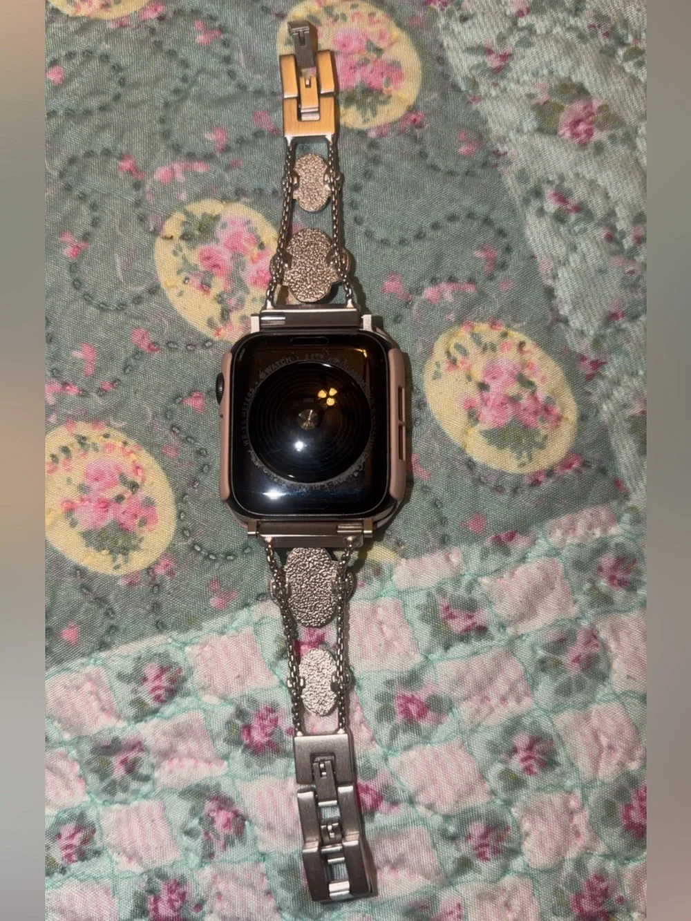 Silver Smartwatch with Multiple Colored Protective Cases and Charger